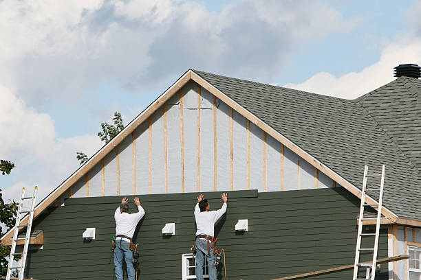 Professional Siding technician working in Pikesville, MD